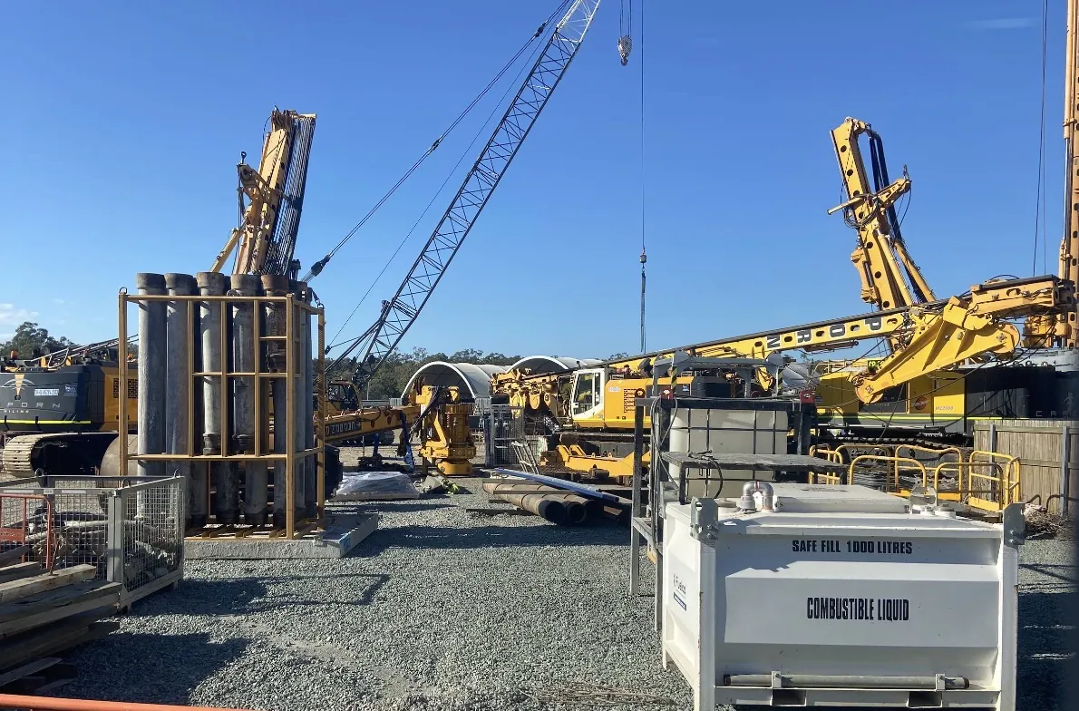 Cranes and piling rigs on a project site