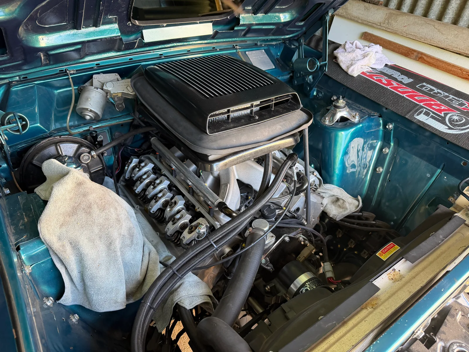 Engine bay of a performance vehicle in the Quinalow workshop